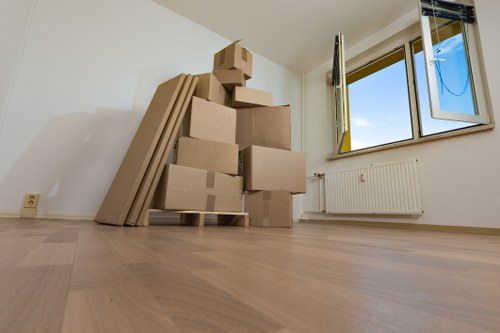 Organised storage unit with home furniture and packed boxes in Grahamepark